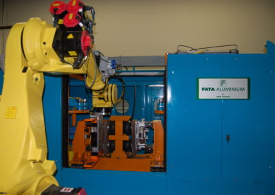 Robot removing and transferring castings from decoring machine